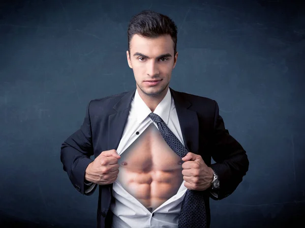 Businessman tearing off shirt and showing mucular body — Stock Photo, Image