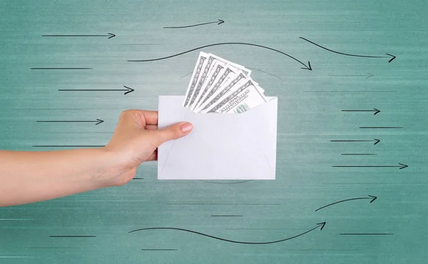 Hand holding envelope with arrows around — Stock Photo, Image