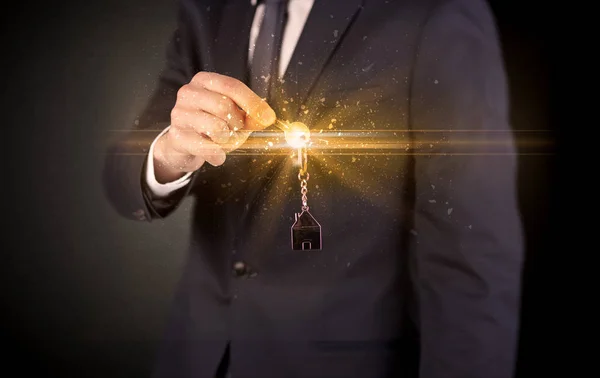 Man hand over keys — Stock Photo, Image