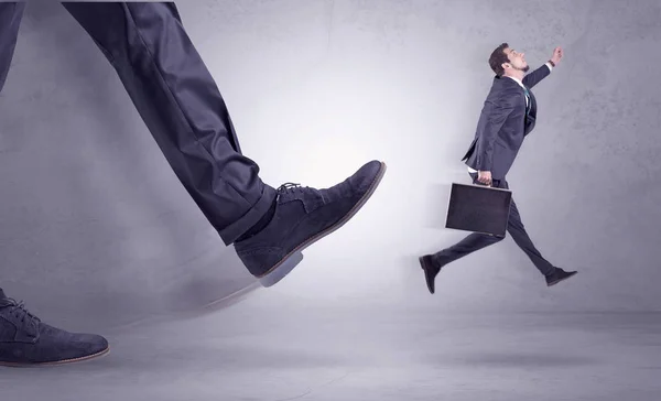 Foot kicking, businessman flying — Stock Photo, Image