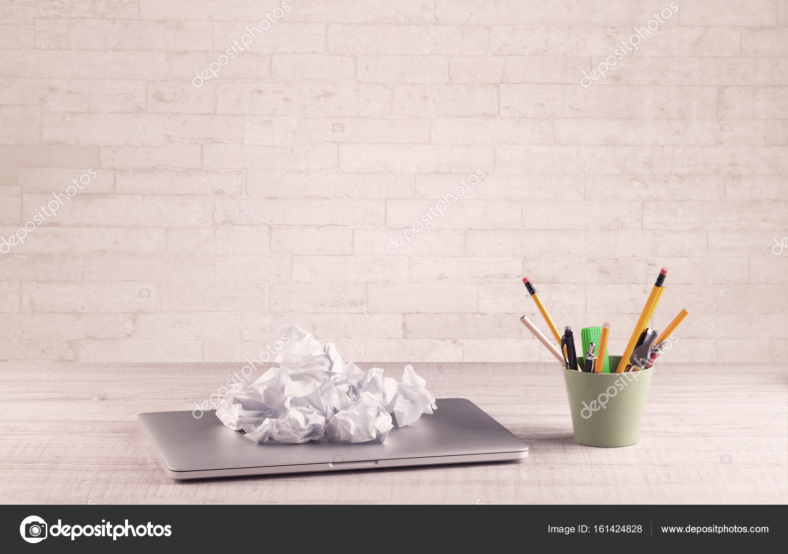 Office Desk Closeup With White Brick Wall Stock Photo