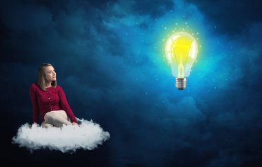 Bir bulut tanımak büyük ampul, üzerinde oturan kadın
