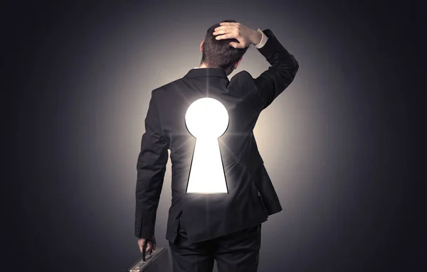 Man standing with black keyhole on his back — Stock Photo, Image