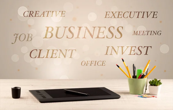 Business office desk with writing on wall — Stock Photo, Image