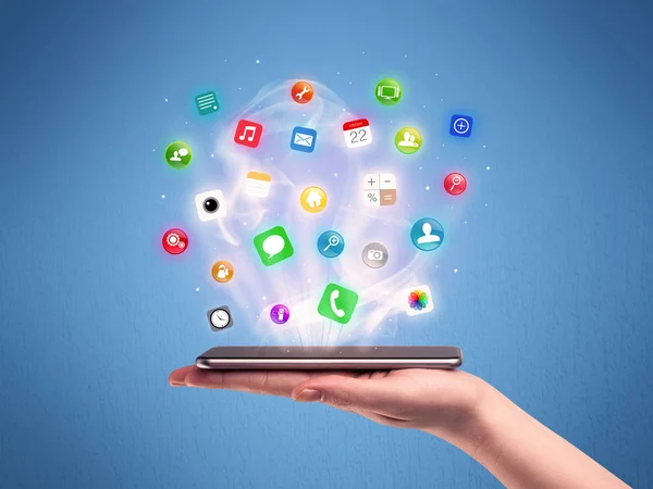Hand holding tablet phone with app icons — Stock Photo, Image