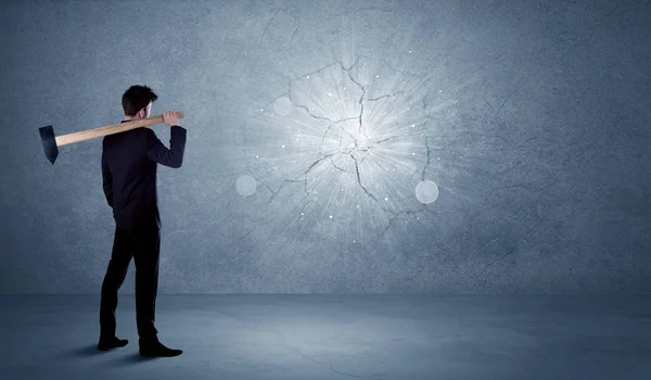 Business man hitting wall with a hammer — Stock Photo, Image