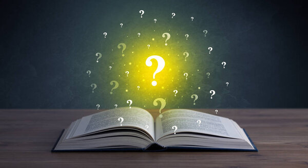 Знаки вопроса над книгой
 