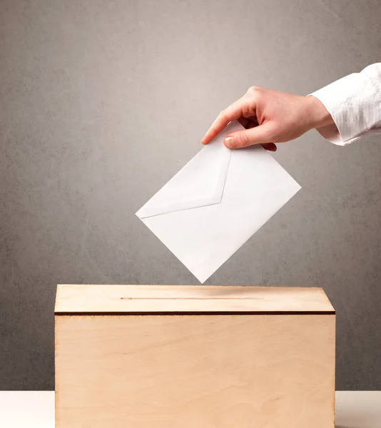 Ballot box with person casting vote — Stock Photo, Image