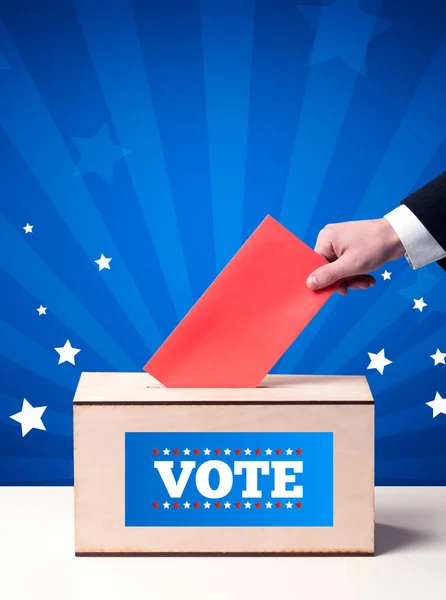 Hand with ballot and wooden box — Stock Photo, Image