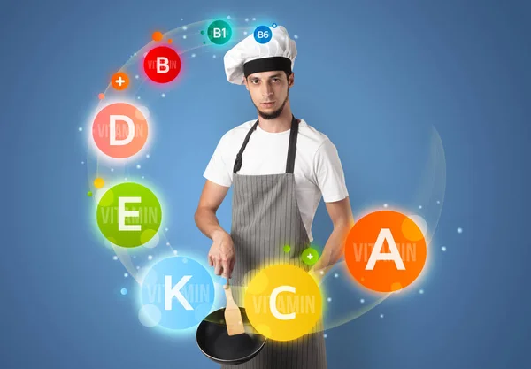 Handsome cook with vitamin concept — Stock Photo, Image