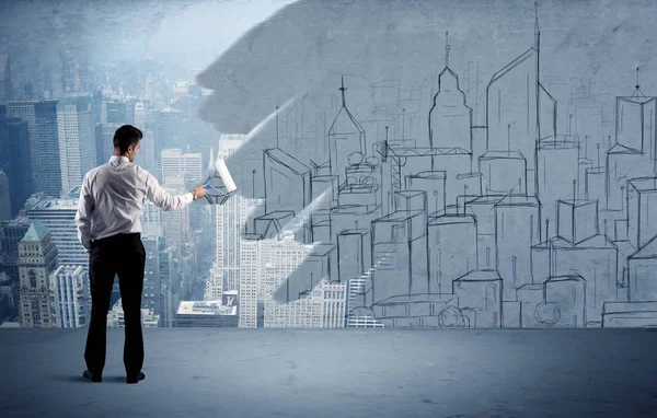 Zarif satıcı şehri duvarda yeniden boyuyor.