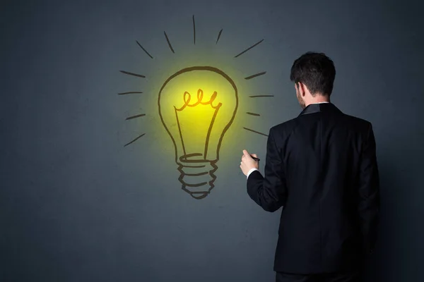 Businessman with lightbulb — Stock Photo, Image