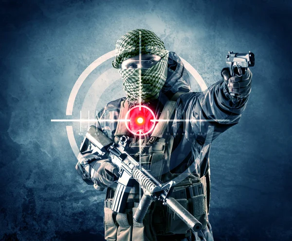 Masked terrorist man with gun and laser target on his body