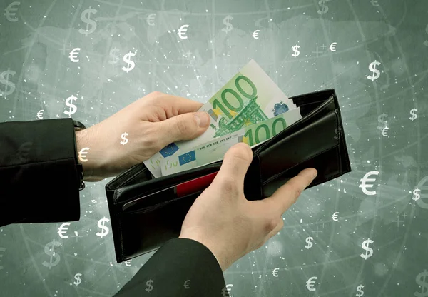 Businessman hand takes out euro from wallet Royalty Free Stock Photos