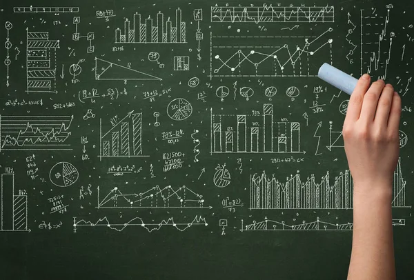 A business person drawing data on chalkboard — Stock Photo, Image