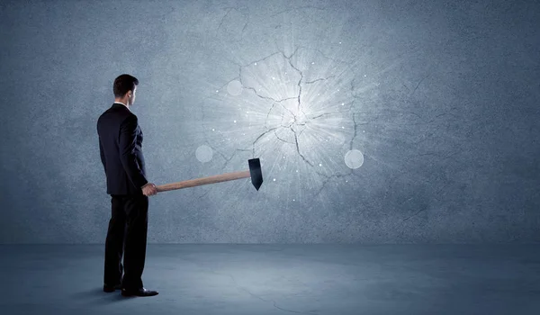 Business man hitting wall with a hammer — Stock Photo, Image