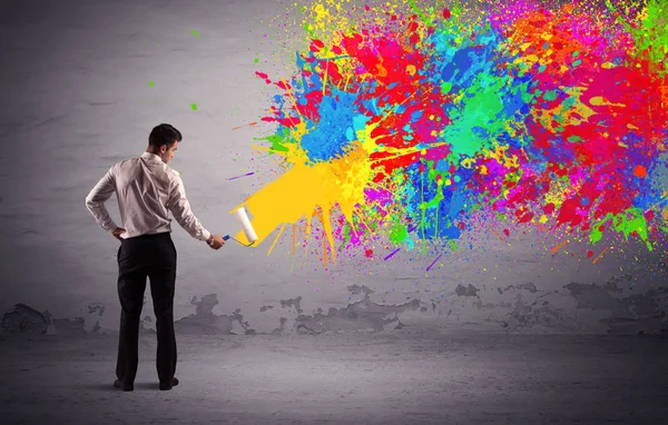 Sales person painting colorful splatter — Stock Photo, Image