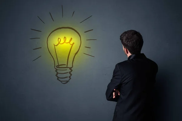 Businessman with lightbulb — Stock Photo, Image