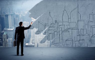 Zarif satıcı şehri duvarda yeniden boyuyor.