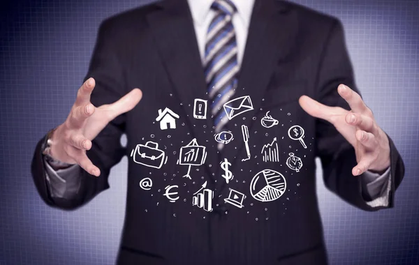 Office worker with drawn icons in the palm — Stock Photo, Image