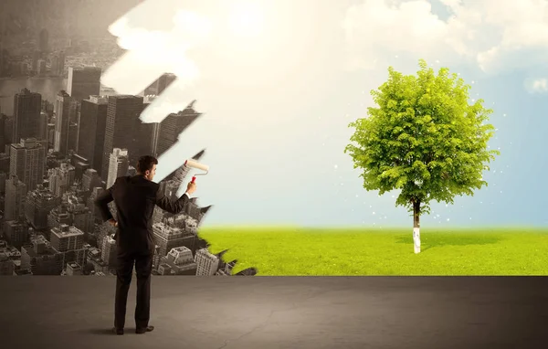 Salesman painting tree instead of city — Stock Photo, Image