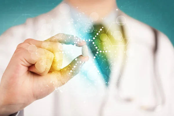 A doctor in tie holding a pill — Stock Photo, Image