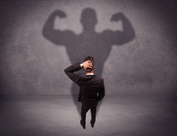 Successful businessman with strong shadow — Stock Photo, Image