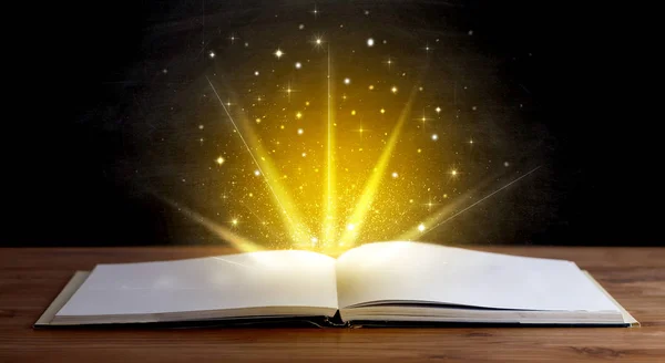 Yellow lights over book — Stock Photo, Image