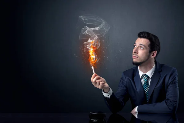 Businessman smoking a cigrette — Stock Photo, Image