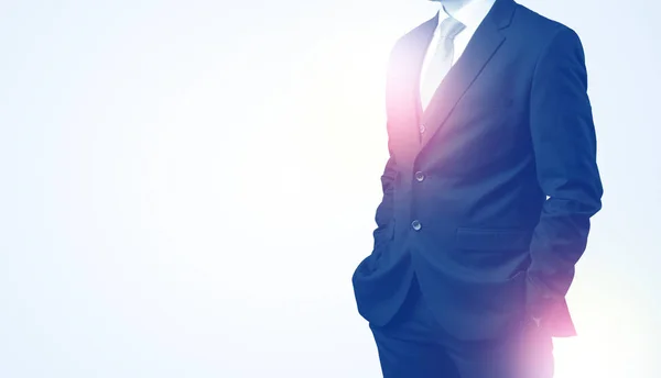 Young businessman standing and thinking — Stock Photo, Image
