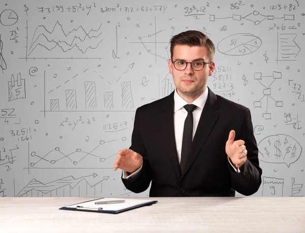 Businessman sitting at a desk — Stock Photo, Image