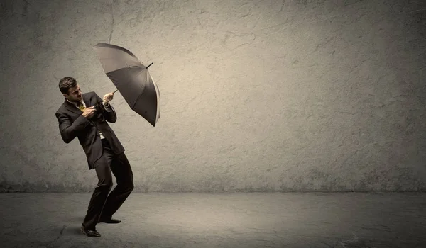 Handsome business man holding umbrella with copy space backgroun — Stock Photo, Image