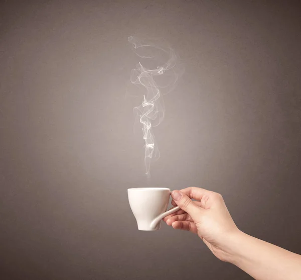 Female hand holding coffee cup — Stock Photo, Image