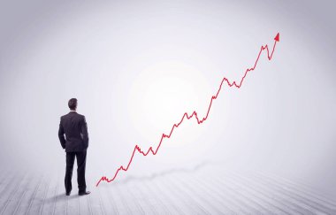 Kırmızı grafik ok ile ayakta işadamı