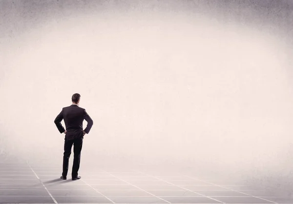 Business person standing in empty space — Stock Photo, Image