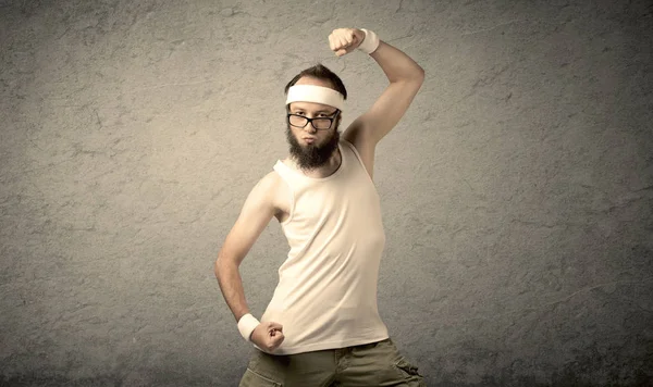 Young male showing muscles — Stock Photo, Image