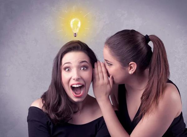 Girl telling secret things to her girlfriend — Stock Photo, Image