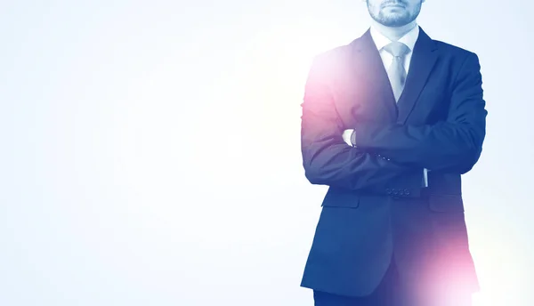 Young businessman standing and thinking — Stock Photo, Image