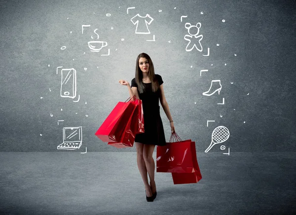 Mujer de compras con bolsos e iconos dibujados —  Fotos de Stock