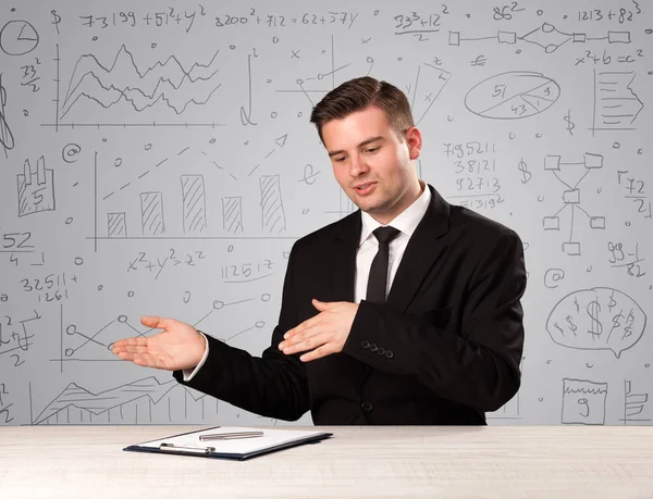 Businessman sitting at a desk — Stock Photo, Image