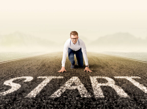 Businessman at start line