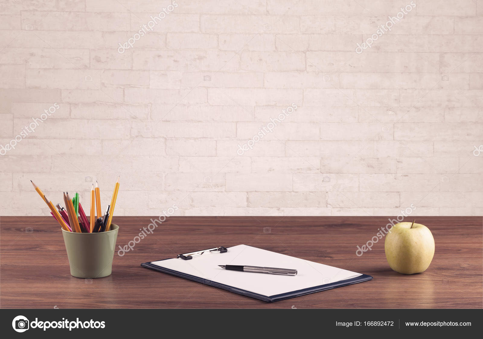 Office Desk Closeup With White Brick Wall Stock Photo