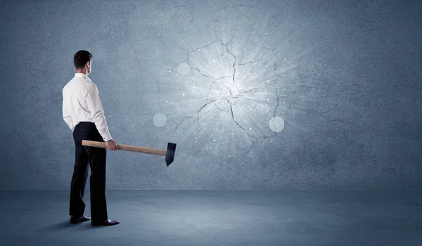 Business man hitting wall with a hammer — Stock Photo, Image