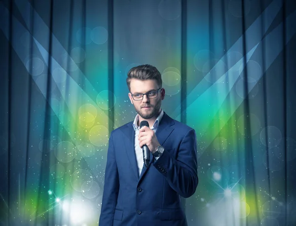 Businessman holding microphone — Stock Photo, Image