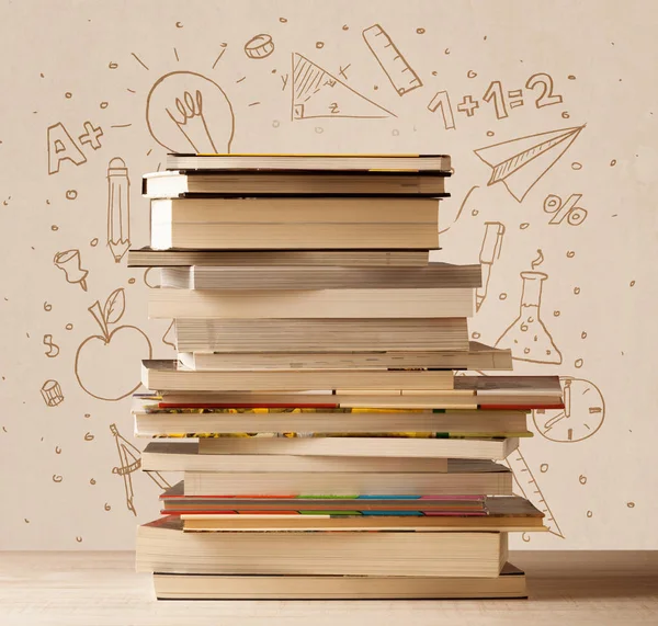 A pile of books on table with school hand drawn doodle sketches — Stock Photo, Image