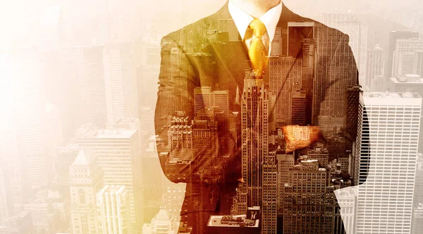 Business man looking at overlay city background — Stock Photo, Image