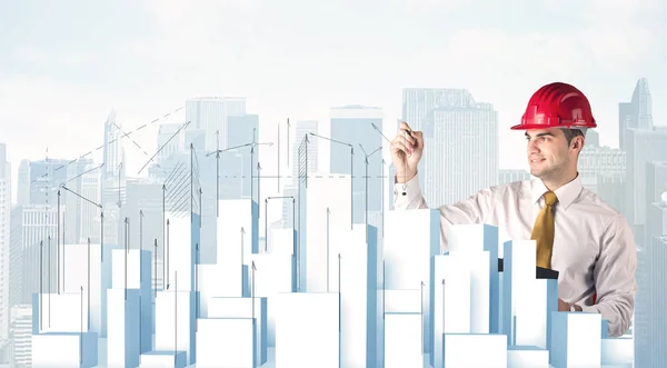 Businessman drawing skyscrapers — Stock Photo, Image