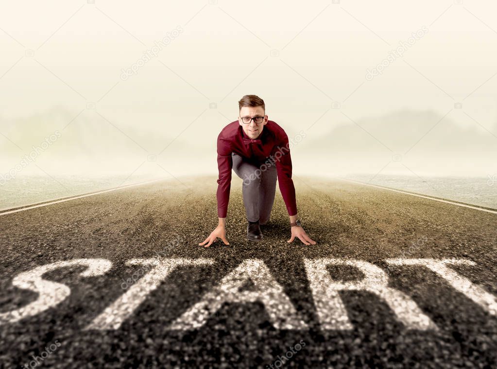 Businessman at start line