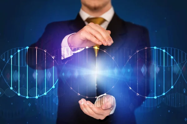 Businessman holding DNA — Stock Photo, Image