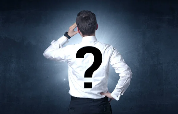 Man standing with question mark on his back — Stock Photo, Image